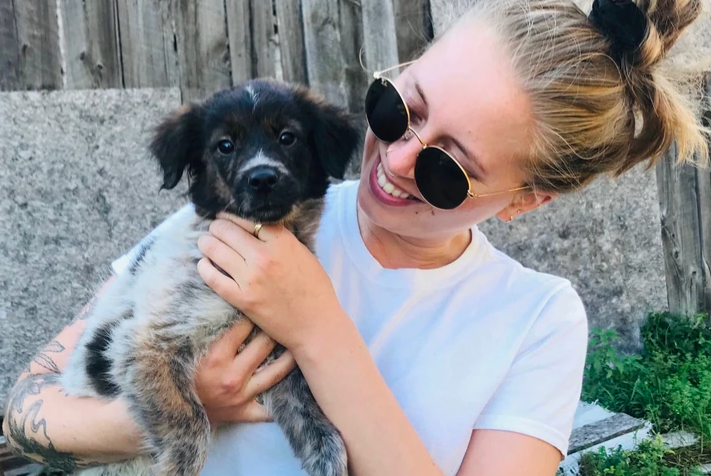 Lucy Cullen holding a puppy