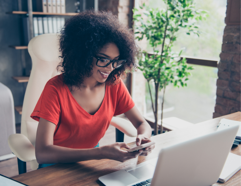 Woman receiving email on cell phone