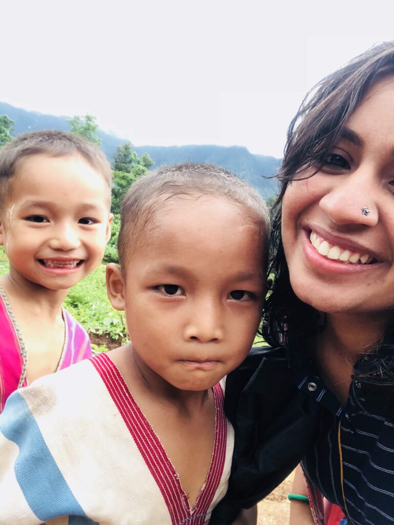 Heena posing for a selfie with small children