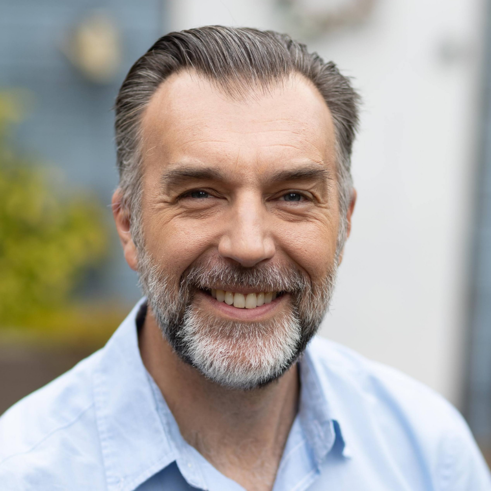 This image has an empty alt attribute, its filename is James-Rowe.png